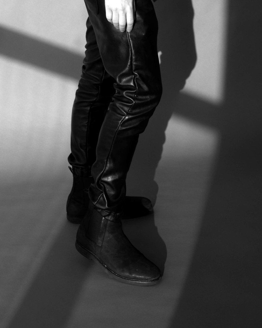 Boots in the window's cross of light